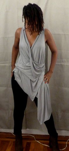 Gray drape top is one of my new tops. You can wear a sports bra under,bikini top,tank top. If you would like the arm hole smaller, please let me know. I love draping tops, because they are stylish for any age,funky,chic and fun to wear. You can wear leggings,skinny jeans or over any plain dress or skirt. The fabric in the picture is rayon Lycra (light weight). I can also make it in ity jersey which is wrinkle free and easy to care for. Every piece of clothing in my shop is made and designed by m