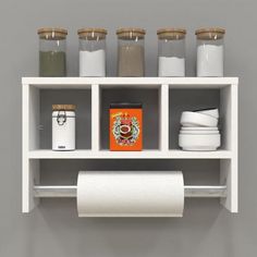 a white shelf filled with lots of different types of toilet paper and other bathroom items