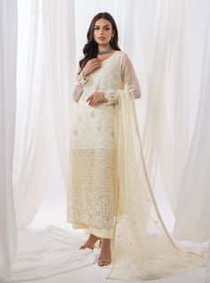 A delicate white silhouette enhanced by floral daaman, intricately embroidered jaal, and laced trims, paired with straight-leg pants and a white net dupatta embellished with lace on all sides making it timeless charm and impeccable craftsmanship. Embrace sophistication and grace with this enchanting ensemble, designed to make you feel effortlessly beautiful on any occasion. Shirt: NetPants: Raw SilkDupatta: Net Designer White Palazzo Set With Intricate Embroidery, Off White Palazzo Set With Intricate Embroidery For Eid, Elegant White Palazzo Set With Chikankari Embroidery, White Palazzo Set With Intricate Embroidery For Eid, White Georgette Palazzo Set With Intricate Embroidery, White Semi-stitched Palazzo Set With Intricate Embroidery, Cream Palazzo Set With Chikankari Embroidery For Eid, Bollywood Style White Palazzo Set With Intricate Embroidery, White Bollywood Palazzo Set With Sheer Dupatta