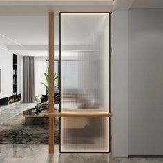 a living room with white walls and flooring next to a large glass partition on the wall