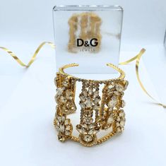 Dolce & Gabbana cuff bracelet Crystals Signed Luxury Adjustable Cuff Bracelet For Party, Adjustable Luxury Cuff Bracelet For Parties, Designer Cuff Bracelet For Parties, Designer Gold Cuff Bracelet Gift, Glamorous Adjustable Cuff Bracelet Gift, Glamorous Adjustable Cuff Bracelet As Gift, Designer Gold Cuff Bracelet As Gift, Designer Adjustable Bracelets For Party, Adjustable Designer Bracelets For Party