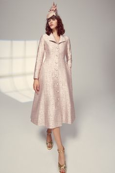 This iconic Hunter Coat Dress silhouette takes inspiration from a vintage hunting coat and is cut from our beautiful blush pink and burnished gold Italian jacquard cloth containing wool and silk. The tailored bodice nips in the waist and features an open collar and a high back neck pitch, as well as a flattering, fluid, semi-circular skirt with side seam pockets. The coat is fully lined in silk. High ball covered buttons add a beautiful feature as well as a secure fastening, giving you the confi Suzannah London, Circular Skirt, Hunt Coat, Vintage Hunting, Metal Dress, Gown Suit, Boutique Couture, Vintage Couture, Pink Midi Dress