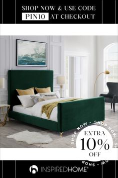 a bed with green velvet headboard and foot board in a white room next to two black chairs