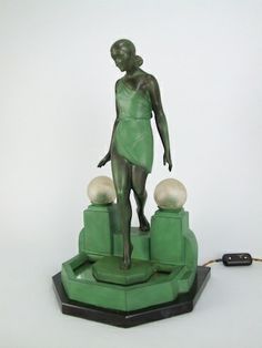 a statue is shown with a remote control in front of it