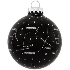 a black ornament with white stars and the names of zodiacs on it