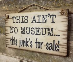 a sign that says, this isn't no museum this junk's for sale