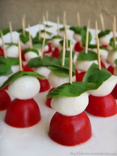 small appetizers with green leaves and red sauces