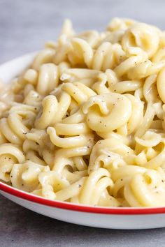 a white bowl filled with macaroni and cheese