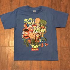 New With Tags Boys Toy Story T-Shirt Size 14-16. If You Have Any Questions Please Ask, Thanks! Blue Fun T-shirt For Playtime, Blue Short Sleeve Themed Tops, Fun Character Print T-shirt For Playtime, Themed Short Sleeve Tops For Playtime, Fun Blue T-shirt For Playtime, Fun Blue T-shirt With Character Print, Playful Blue T-shirt For Playtime, Fun Blue Tops With Character Print, Blue Pre-shrunk T-shirt For Playtime