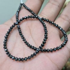 Elegant Black Diamond Bead Far Size Huge black diamond bead 3.8 mm Natural Black Diamond Faceted Rondelle Bead Rare black diamond Necklace Stone: Diamond Shape: Rondelle Beads Size: 3.2 - 4 mm Quality: AAA Grade High Quality Black diamonds are believed to possess various metaphysical powers and are associated with protection, grounding, and healing. They are thought to absorb negative energy and promote clarity of thought. Some people wear black diamond jewelry as a symbol of strength, resilienc Black Rondelle Spacer Beads Jewelry, Black Round Gemstone Beads, Black Gemstone Round Beads, Black Faceted Round Beads, Black Diamond Necklace, Black Diamond Jewelry, Necklace Stone, Symbols Of Strength, Black Diamonds