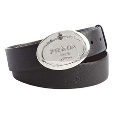 This belt is crafted with a black saffiano leather. The oval engraved Prado logo silver buckle is such a statement piece with the Prada logo. This Prada belt is so classic and goes great with every look!     Model: 2CM046  Size: 110/44  Black Saffiano Leather  Silver-toned hardware  Palladium plaque buckle  Includes Prada authenticity card and dust bag  Made in Italy Designer Black Belt Buckle With Silver-tone Logo, Designer Black Belt Buckles With Silver-tone Logo, Modern Business Belt Buckles With Logo Plaque, Modern Business Belt Buckle With Logo Plaque, Elegant Black Belt Buckles With Logo Plaque, Elegant Black Belt Buckle With Logo Plaque, Formal Black Belt Buckle With Logo Plaque, Luxury Black Belt With Silver-tone Logo Plaque, Luxury Black Belt With Silver-tone Logo