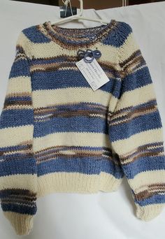 This beautiful sweater is made of acrylic yarn in cream, denim blue and a brown variegated yarn in a stripe pattern.  Machine washable and dryable. Blue And Brown Fashion, Blue Sweater Outfit Aesthetic, Blue Brown Outfit, Blue And Brown Outfit, Creme Outfits, Knit Striped Sweater, Stripe Knit Sweater, Light Blue Knit, Cream Outfits