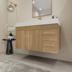 a bathroom with a sink, mirror and wooden cabinet in the corner next to a rug