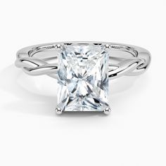 a princess cut diamond ring with twisted band