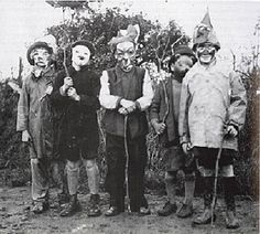 an old black and white photo of five clowns