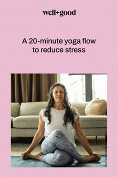 a woman is sitting on the floor doing yoga