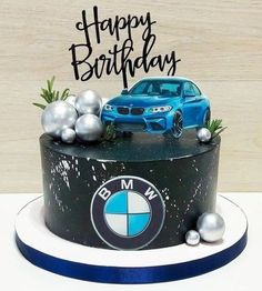 a birthday cake with a bmw car on it