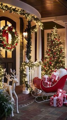 a sleigh with presents and christmas decorations on the front porch