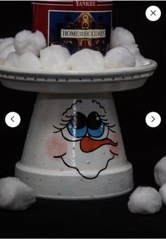 cotton balls are piled on top of a bowl