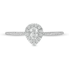 a pear shaped diamond engagement ring on a white background