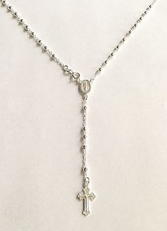 "925 sterling silver italian rosary 20\" long . for protection and good luck made in italy 3 mm beads gr:7.4 rosario de 925 plata esterlina -20\" largo .para proteccion y buena suerte . hecho en italia 3mm beads gr:7.4" Dainty Silver Necklace With Miraculous Medal, Sterling Silver Cross Rosary In Silver, Silver Sterling Silver Cross Rosary, Silver Miraculous Medal Necklace With Round Beads, Adjustable Silver Crucifix Necklace, Adjustable Silver Crucifix Rosary, Silver Jewelry With Miraculous Medal And Round Beads, White Gold Sterling Silver Rosary As Gift, Sterling Silver Rosary With Silver Beads As Gift