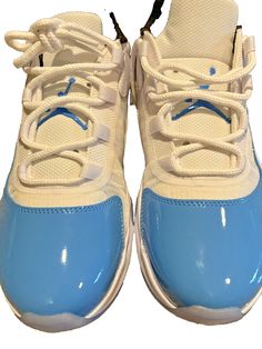 You are looking at a great item. Nike Air Jordan 11 CMFT Low White University Blue Back DN4180-114 Men's Size 8 Elevate your sneaker game with the Nike Air Jordan 11 CMFT Low White University Blue Back DN4180-114 in size 8. These sneakers are perfect for any occasion, whether it's for activewear or casual wear. The shoe features a lace-up closure and a low-top shoe shaft style. The upper material is made of patent leather, and the lining material is fabric. The sneaker has a cushioned, comfortable, and breathable design, making it perfect for any season. The outsole material is rubber, providing excellent traction and durability. These sneakers are part of the Air Jordan product line, which is known for its high-quality and stylish designs. The colorful and outdoor theme of these sneakers Air Jordan 11 Cmft, Jordan 11 Cmft Low, Nike Air Jordan 11, Blue Back, Air Jordan 11, Sneaker Games, University Blue, Jordan 11, Jordan Shoes