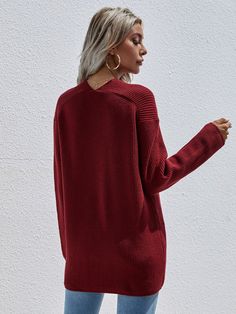 Our Marjorie Knit comes in solid tone print. It features a v neckline, long relaxed sleeves and a textured knit pattern all over the garment. This knit is perfect for layering during the cold winter months! Size Guide: Melina is 5’6” tall, and has a 33.5” bust, 24.8”waist, & 37.4” hips. She is wearing a S / US 4 / AU 8. This knit sweater is true to size. Material: 50% Acrylic, 30% polyamide, 20% polyester. Key Features: Relaxed fit. V neckline. Pull on style. Care Instructions: Machine wash / Co Oversized Textured Knit V-neck Outerwear, Winter V-neck Textured Knit Cardigan, Winter Textured Knit V-neck Cardigan, V-neck Ribbed Sweater For Layering, Oversized V-neck Sweater For Fall, Long Sleeve V-neck Sweater For Layering, Cozy Ribbed V-neck Long Sleeve Sweater, Ribbed V-neck Sweater For Layering, Textured Knit V-neck Outerwear