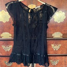 Vintage Forever 21 Elegant Classy Black Lace Blouse With Tie In The Back And Front. I’ve Had This For Soooo Long But Have Never Worn It! Feminine Black Lace Top For Summer, Sheer Summer Blouse For Date Night, Sheer Blouse For Date Night In Summer, Black Sheer Feminine Top, Black Summer Blouse For Going Out, Summer Lace Top For Night Out With Short Sleeves, Party Lace Top Sleeveless Blouse, Chic Fitted Blouse From Forever 21, Chic Sleeveless Lace Top Blouse