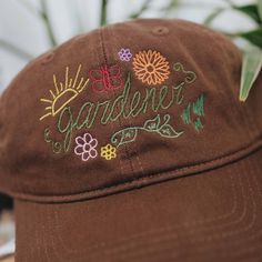 "Designed and embroidered in Dallas Texas, this gardener baseball cap is the perfect match for anyone who loves to get their hands dirty and nurture their plants. Direct embroidery, only available here at Embroidered Dad Hats! 🧢 * Embroidered on a cotton dad hat. * Adjusts up to 24\" in circumference. * Unstructured and low profile fit. * Free poly-bag shipping in 🇺🇸 (more options at checkout). Embroidered from our small shop in Dallas, TX ❤️ ➡ www.embroidereddadhats.etsy.com IG: @Embroidered Spring Outdoor Baseball Cap With Embroidered Logo, Outdoor Baseball Cap With Embroidered Logo For Spring, Spring Outdoor Hat With Embroidered Logo, Adjustable Hat With Letter Embroidery For Spring, Spring Adjustable Hat With Letter Embroidery, Curved Brim Hat With Letter Embroidery For Spring, Adjustable Spring Hat With Letter Embroidery, Spring Curved Brim Hat With Letter Embroidery, Spring Cap With Letter Embroidery