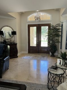 a living room filled with furniture and a door