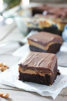 two pieces of chocolate peanut butter cake on napkins