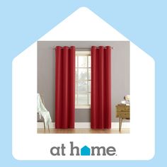 a red curtain hanging in front of a window with the words at home on it