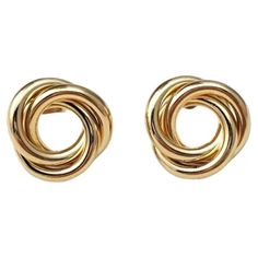 Vintage 14K Yellow Gold Twist Earrings - These captivating earrings feature intertwined links that are a stunning addition to any outfit. Weight: 1.6 dwt/ 2.3 g Size: 12.1 mm X 12.82 mm Hallmark: 14K Very good condition, professionally polished. Will come packaged in a gift box or pouch (when possible) and will be shipped U.S. Priority Mail Insured. AD122723/17KCS Gold Knot Earrings, Twist Earrings, Knot Earrings, Jewerly Diy, Modern Earrings, Modern Jewelry, Priority Mail, Hallmark, Knot