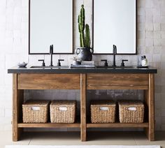 a bathroom with two sinks and mirrors on the wall above it is also a rug