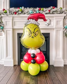 an inflatable balloon sitting on top of a wooden floor next to a fireplace