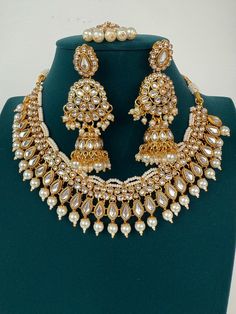 White Pearl Kundan Necklace Set with jhumka and Tikka  Arrives in a gift box! Stud Size:1.5 Inches Luxury Temple Jewelry Chandbali Bridal Sets, Luxury Gold-plated Kundan Necklace For Festivals, Luxury Temple Jewelry With Latkans, Luxury Jeweled Chandbali Temple Necklace, Luxury 22k Gold Kundan Necklace For Ceremonial Occasions, Luxury White Temple Jewelry Jhumkas, Luxury Temple Necklace For Reception During Diwali, Luxury Traditional White Temple Necklace, Luxury Kundan Temple Necklace For Diwali