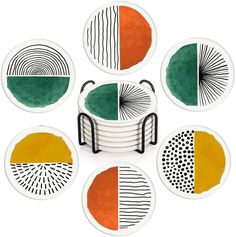 six plates with different designs on them and one has an orange, green and black design