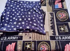 an american flag is laying on top of the u s army patchwork fabric that has been sewn together