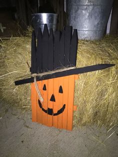 a halloween decoration made out of wood sticks