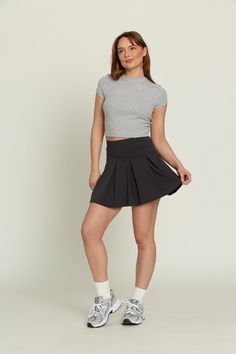 Our Off-Black Wide Pleat Tennis Skirt is a freshly designed take on our famous pleated tennis skirt. The wide pleats provide more length than the original pleated skirts and add a touch of sophistication to any outfit. It features built-in spandex shorts that include a comfortable fit and side pockets for storage. Tenis Skirt Outfits Black Summer, Tenis Skirt Outfits, Checked Skirt Outfit, Black Tennis Skirt Outfit, Skirt Dark Academia, Black Tennis Skirt, Checked Skirt, Tennis Skirt Outfit, Pleated Tennis Skirt