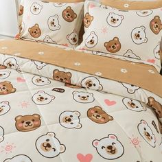 a bed with teddy bears and hearts on it