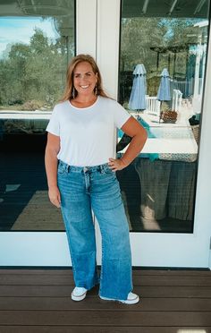 A casual classic from Kut from the Kloth, these wide-leg jeans complement your figure with soft, low-stretch denim and signature Fab Ab front pockets. Color: GrippingTrue to size. Janell is 5'5" and a size 6 wearing size 6. Dana is 5'4" and a size wearing size 12. 93% COTTON, 6% POLYESTER, 1% SPANDEXInseam: 27" Leg Opening: 23" Rise: 10 1/2" Nickel And Suede, School Collection, Fall Transition, Raw Hem Jeans, Athleisure Wear, Dress Hats, Back Design, White Tee, Wide Leg Jeans