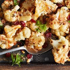 roasted cauliflower with cranberries and walnuts on a serving platter