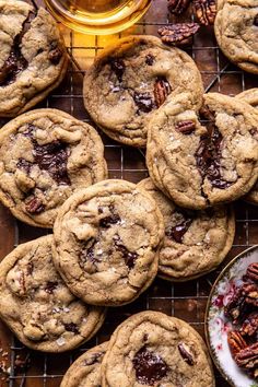 chocolate chip cookies with pecans on a cooling rack