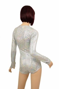 "This item is made to order, please read all the way through the listing before purchasing! This bodysuit is made of a beautiful shimmering frostbite shattered glass holographic print spandex. Long sleeves and boy cut legs. Four way stretch for a figure forming fit. This bodysuit is unlined. Womens Sizing (See below for instructions on where measurements should be taken) XXS: Bust 29\"-30\" / Waist 22\"-23\" / Hips 30\"-32\" Extra Small: Bust 31\"-32\" / Waist 24\"-25\" / Hips 33\"-35\" Small: B Party Silver Shiny Bodysuit, Metallic Shimmer Fitted Bodysuit, Metallic Fitted Long Sleeve Bodysuit, High-stretch Rave Bodysuit For Parties, Purple Holographic Bodysuit, Boy Cut, Holographic Print, Romper Bodysuit, Boy Cuts