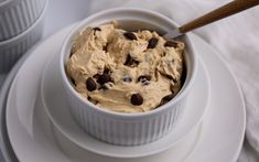 a white bowl filled with chocolate chip cookie dough