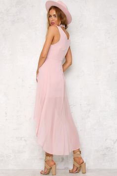 You'll be the picture of elegance in the Ballerina Twirl Maxi Dress thanks to its classic silhouette and gorgeous high-low chiffon-esque skirt. There is a hidden zipper on the back. Wear it with nude heels and a messy bun. Dress. Lined. Cold hand wash only. Model is standard XS and is wearing XS. True to size. Non stretchy fabric. Polyester. Elegant High-low Hem Prom Dresses, Elegant Prom Dresses With High-low Hem, Flowy Asymmetrical Party Dress, Party Dress With Flowy Asymmetrical Skirt, Party Dress With Asymmetrical Hem And Flowy Skirt, Party Dress With Asymmetrical Flowy Skirt, Pink Chiffon Dress With Asymmetrical Hem, Chiffon High-low Hem Party Dress, Chiffon High-low Hem Dress For Spring