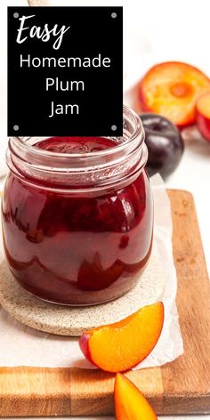 homemade plum jam in a jar on a cutting board