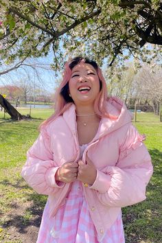 This super-cute pastel pink puffer features puffy bear ears, a gold zipper and buttons, and ruffle detailing on the sleeves. The Pink Marshmallow Bear Puffer is light enough for a cool Spring day and like the name implies - it's super fluffy like a marshmallow! Perfect for a day in the park or running errands in style. Model wearing size S. Pink Hooded Puffer Jacket For Spring, Pink Long Sleeve Puffer Jacket With Zipper Closure, Fluffy Pink Spring Outerwear, Fluffy Pink Outerwear For Spring, Trendy Pink Hooded Puffer Jacket, Spring Puffy Outerwear, Casual Fluffy Outerwear For Spring, Pink Kawaii Outerwear For Winter, Trendy Pink Fluffy Outerwear