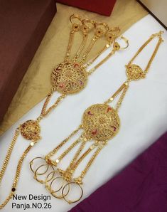 Pack Of 1 Pair Of Hand Panja (2 Pcs) Enhance your bridal look with our elegant gold plated bridal hathphool hand panja. This exquisite hand chain, also known as hathphool, is designed to adorn your hands and add a touch of glamour to your wedding ensemble. The intricate design and gold plated finish of the panja create a captivating statement piece. Each detail is meticulously crafted to enhance the beauty of the bride's hands. The adjustable chain ensures a comfortable fit, allowing you to wear it with ease throughout the festivities. Whether you're a bride-to-be or attending a special occasion, this gold plated bridal hathphool hand panja is a perfect choice to complete your look. Embrace the traditional elegance and make a lasting impression. I make every item of my collection with a lo Gold Hathphool Design, Gold Hathphool, Gold Panja For Hand, Hathphool Gold, Bridal Hathphool, Hand Panja, Bracelet For Wedding, Kundan Bracelet, Spring Jewelry Trends